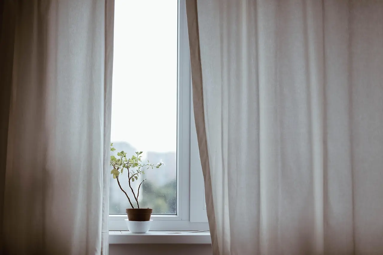 Sheer linen curtain diffusing window light