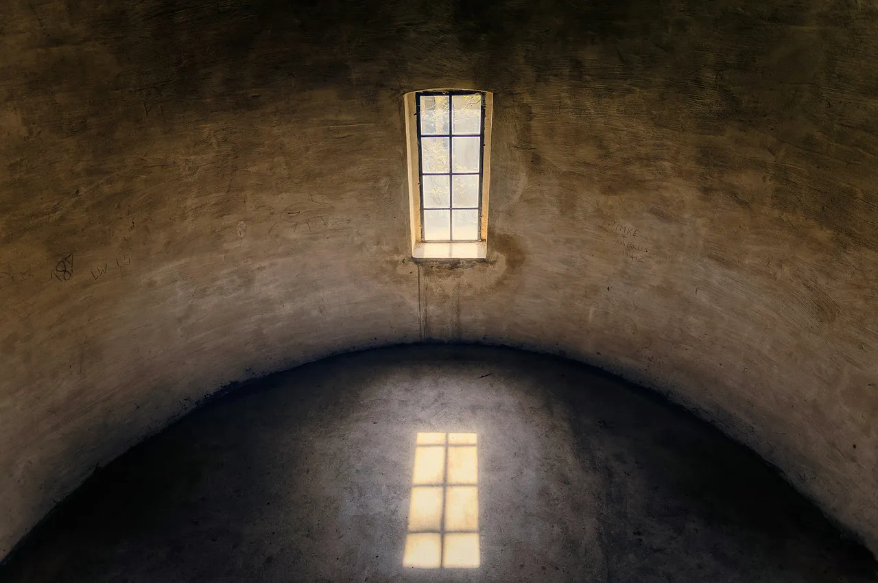 A quiet stone room holding one window of morning light